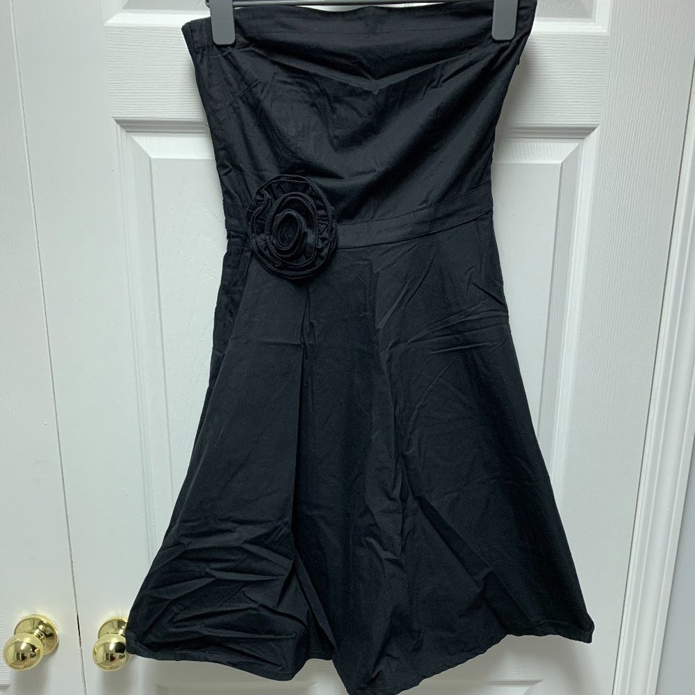 Black Dress with a Statement Flower
